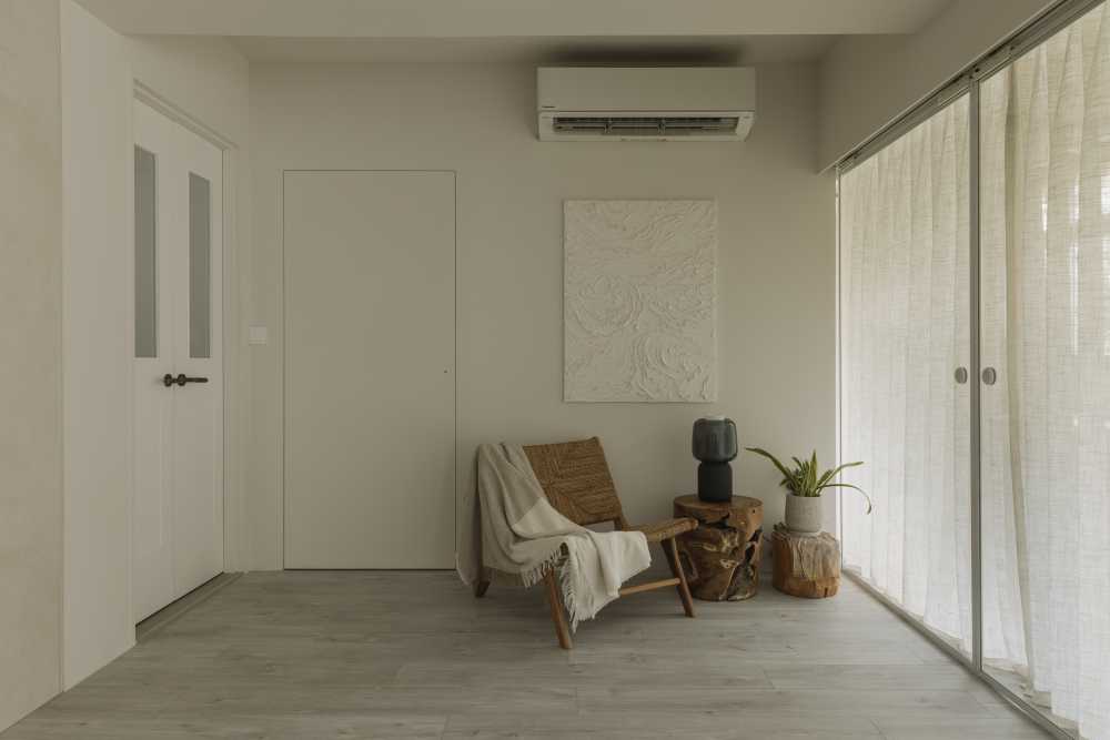 minimalist living room with artwork and bedside table