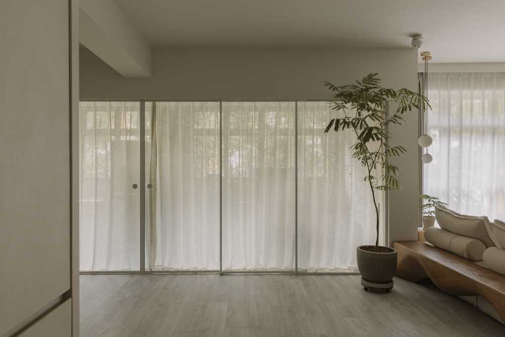 minimalist living room with console table and homogeneous tiles