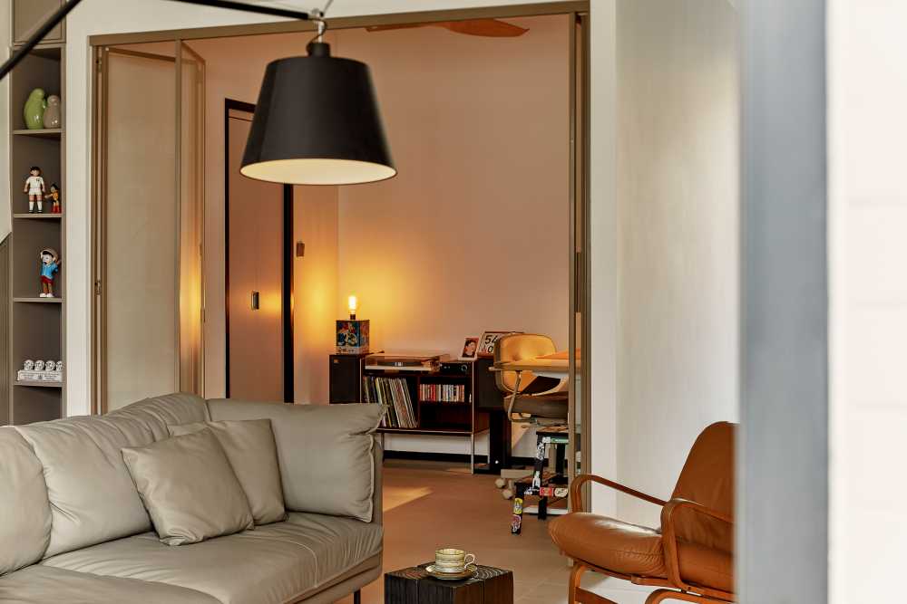 eclectic living room with drop light and sofa