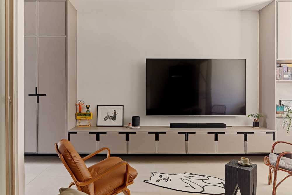 eclectic living room with tv console and tv