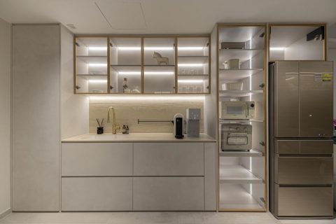 minimalist kitchen with glass door and drawer units