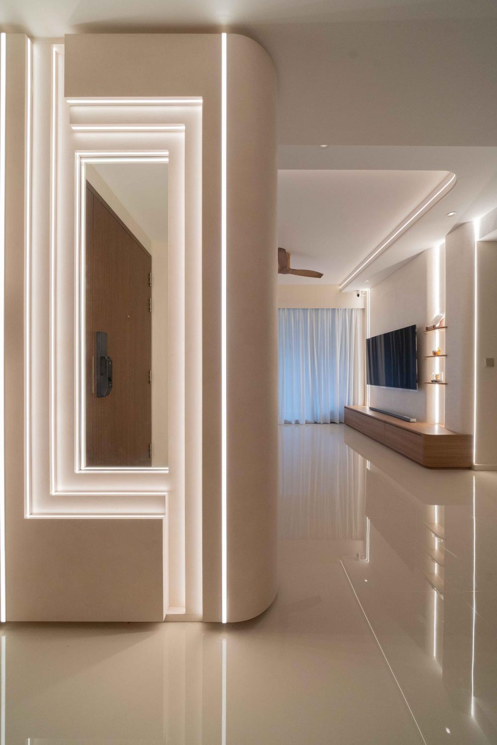 contemporary foyer with cove lighting and artwork