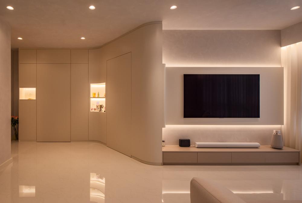 minimalist living room with tv console and cove lighting