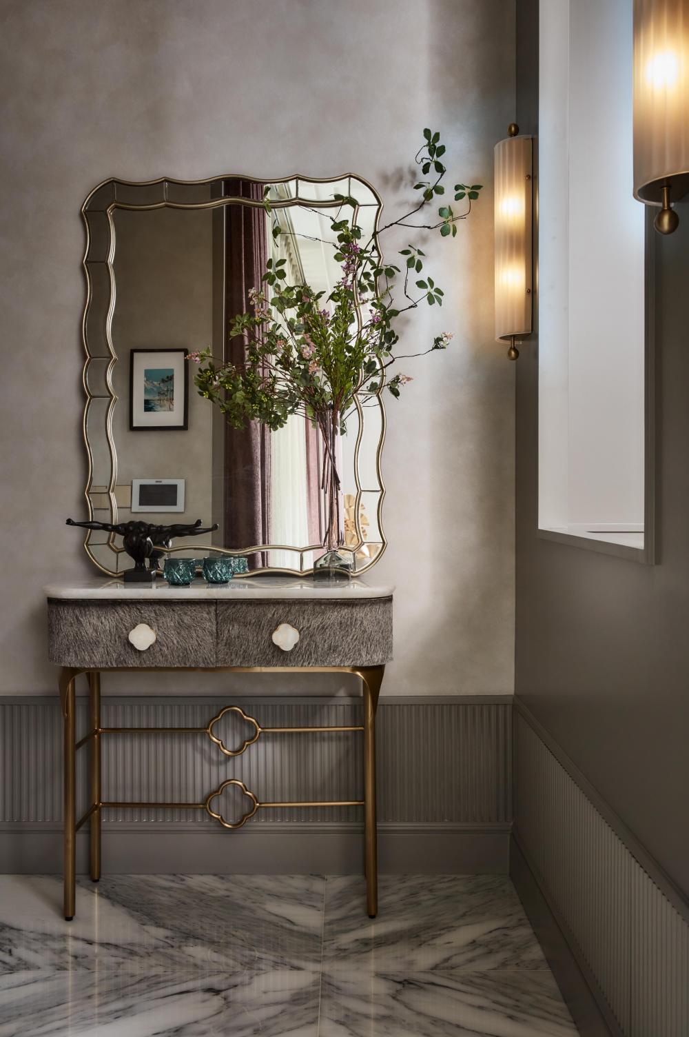 modern foyer with artwork and console table