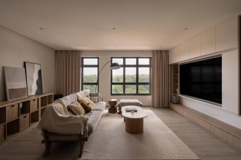 scandinavian living room with bookshelf and tv console