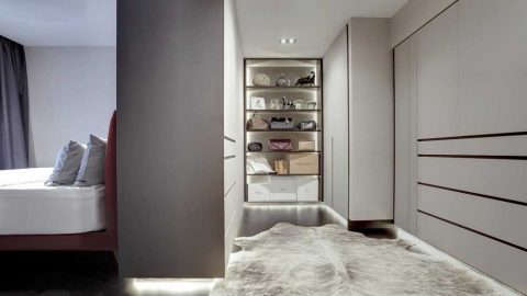 scandinavian walk in wardrobe with wardrobe and carpet