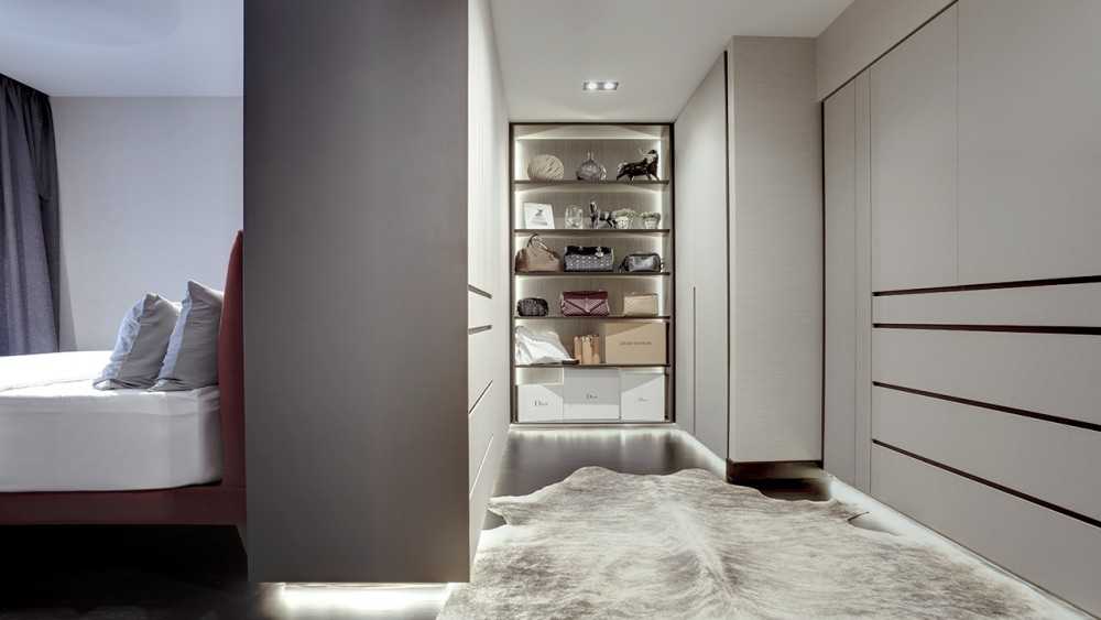 scandinavian walk in wardrobe with wardrobe and carpet