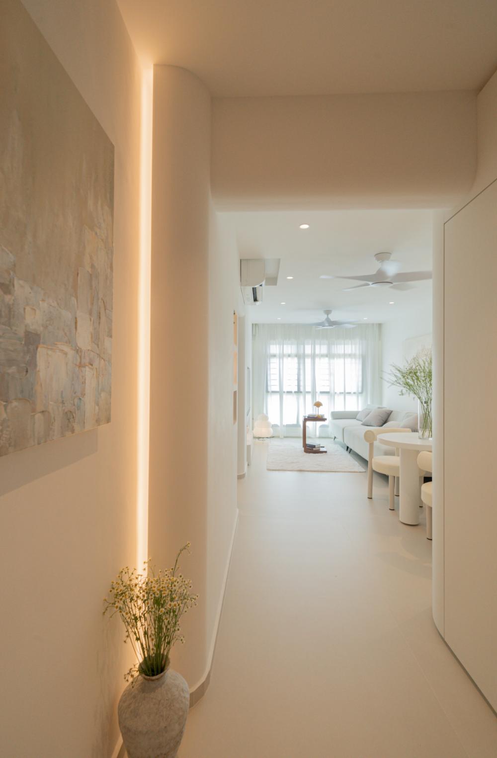 minimalist entryway with shoe cabinets and lighting