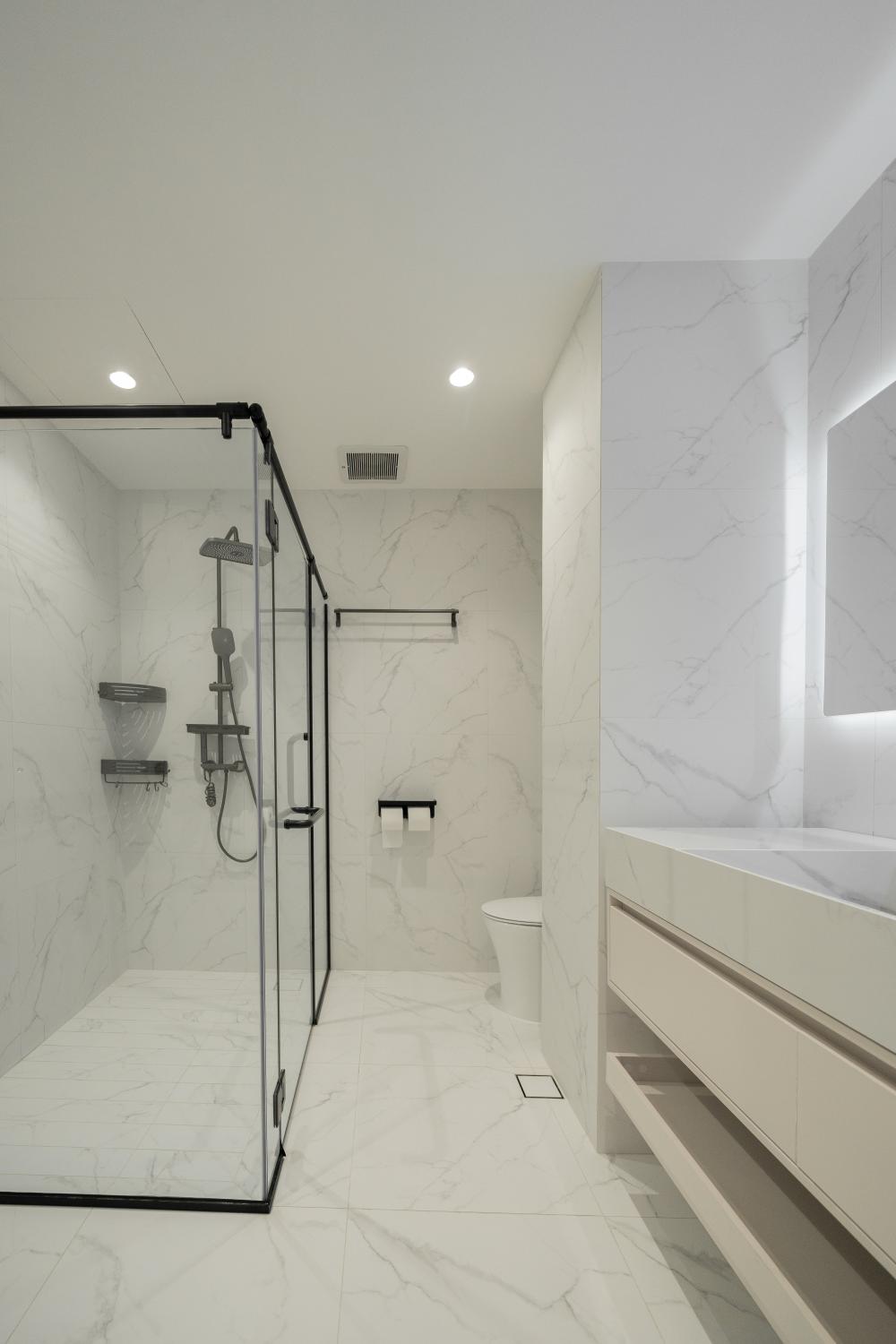 modern bathroom with marble floor and shower screen
