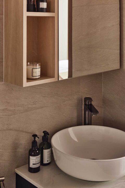 scandinavian bathroom with countertop and mirror