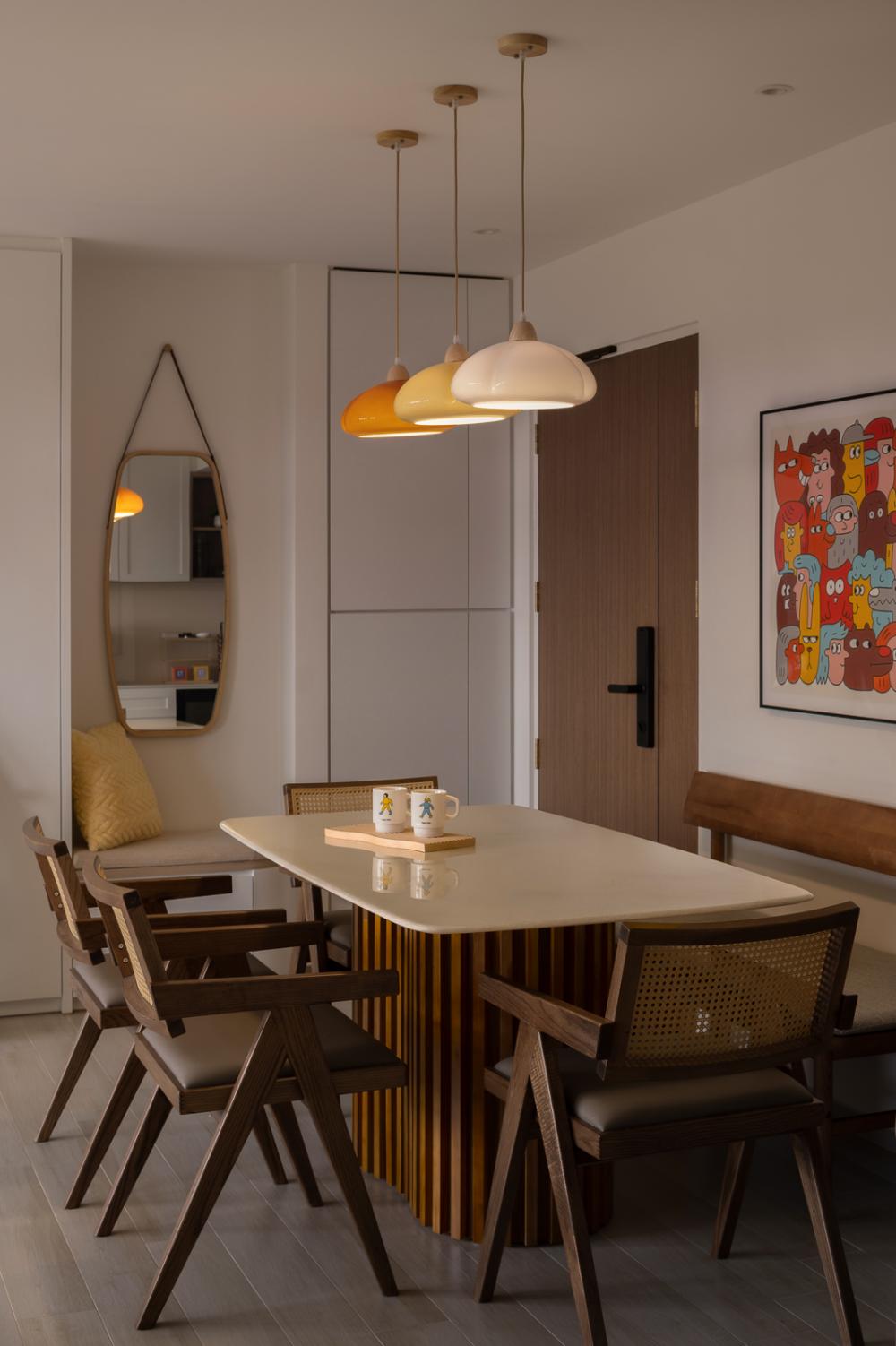 scandinavian dining room with drop light and dining table