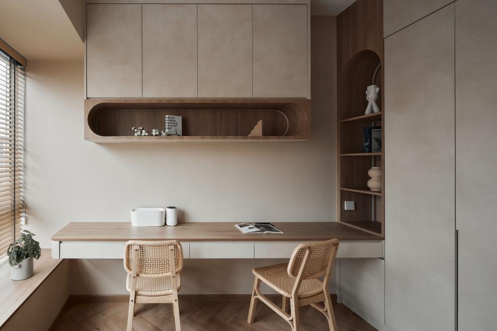 modern study with bookshelf and desk chairs