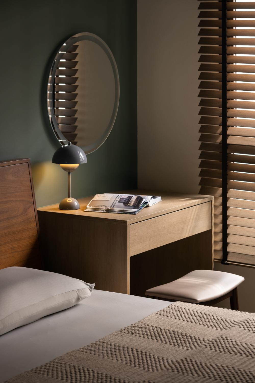 transitional bedroom with bedroom dresser and queen bed