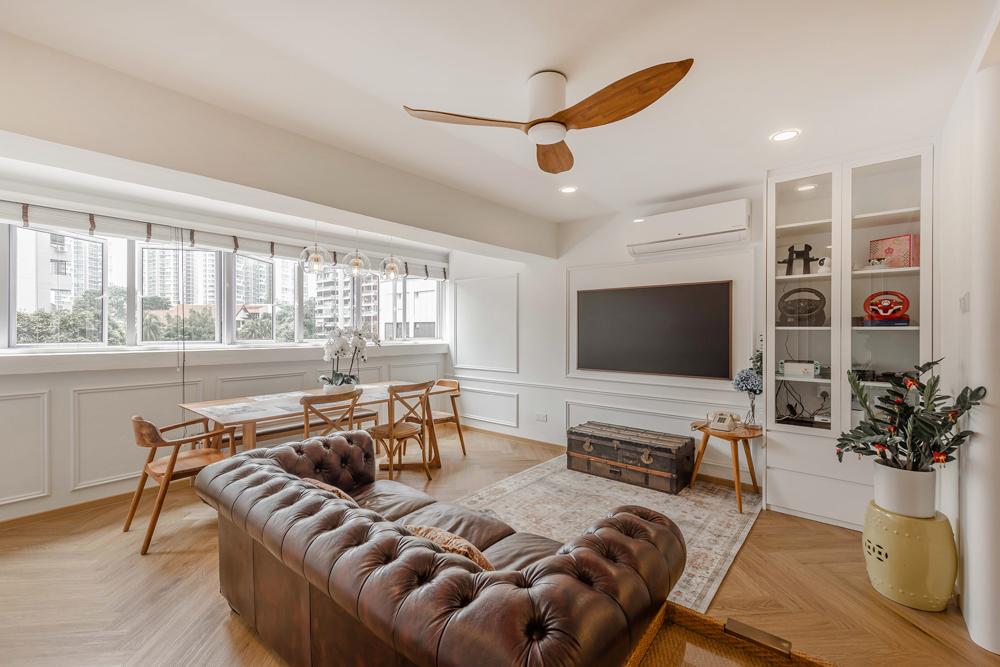 transitional living room with vinyl flooring and feature wall
